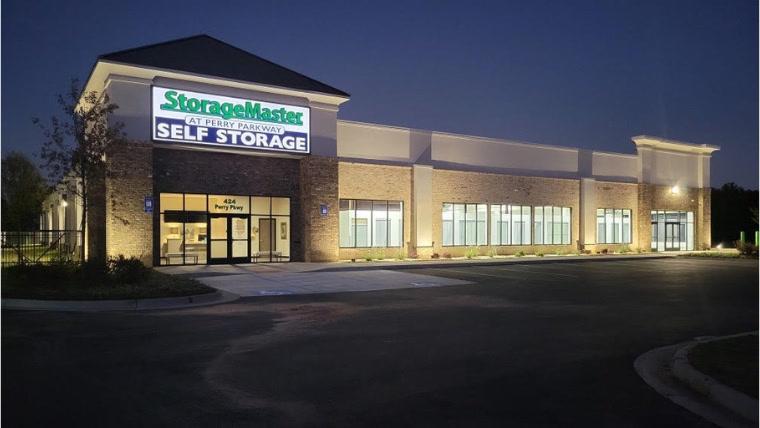 Exterior of a self-storage facility with lighting at night