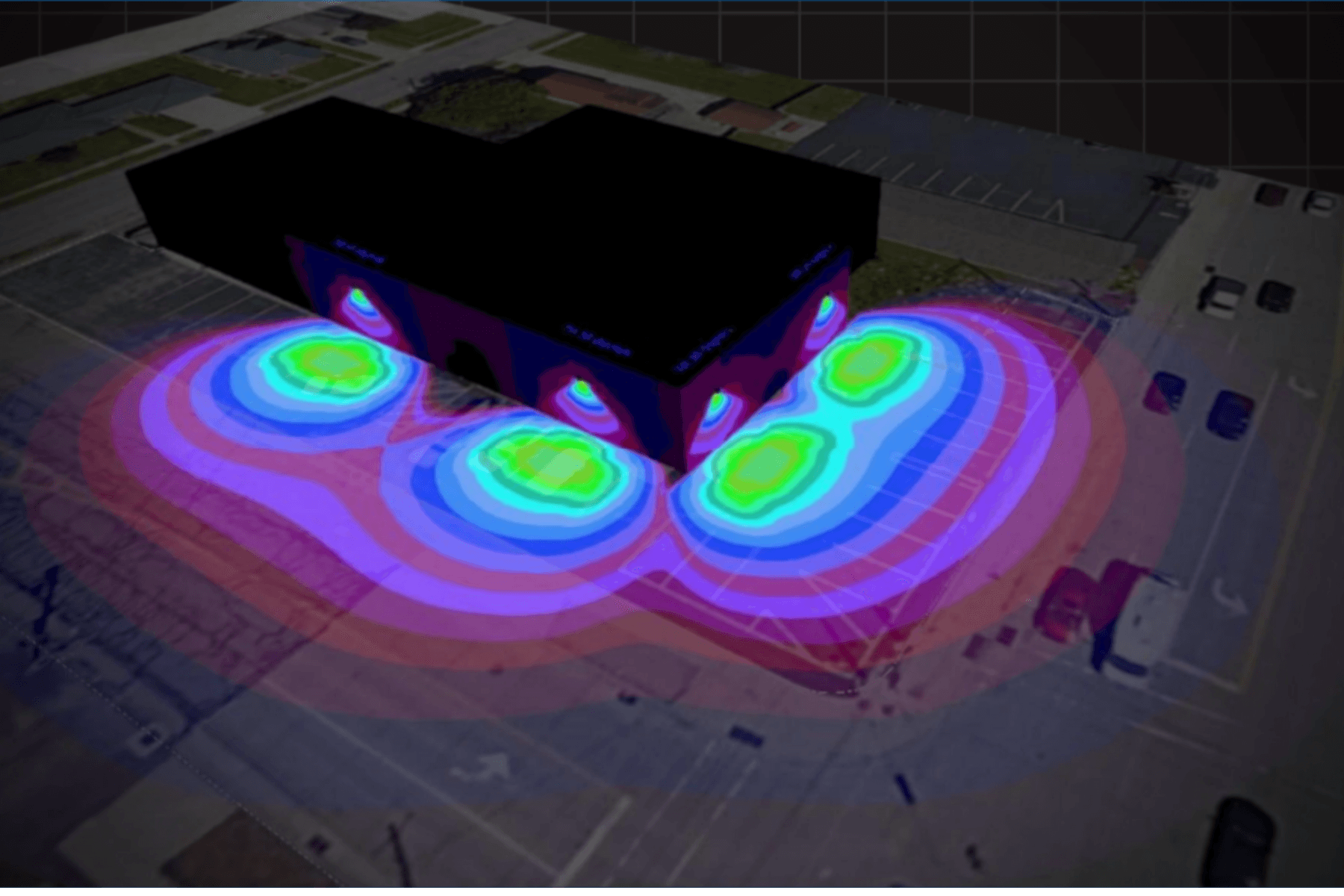 Commercial property at night illuminated by exterior site lighting